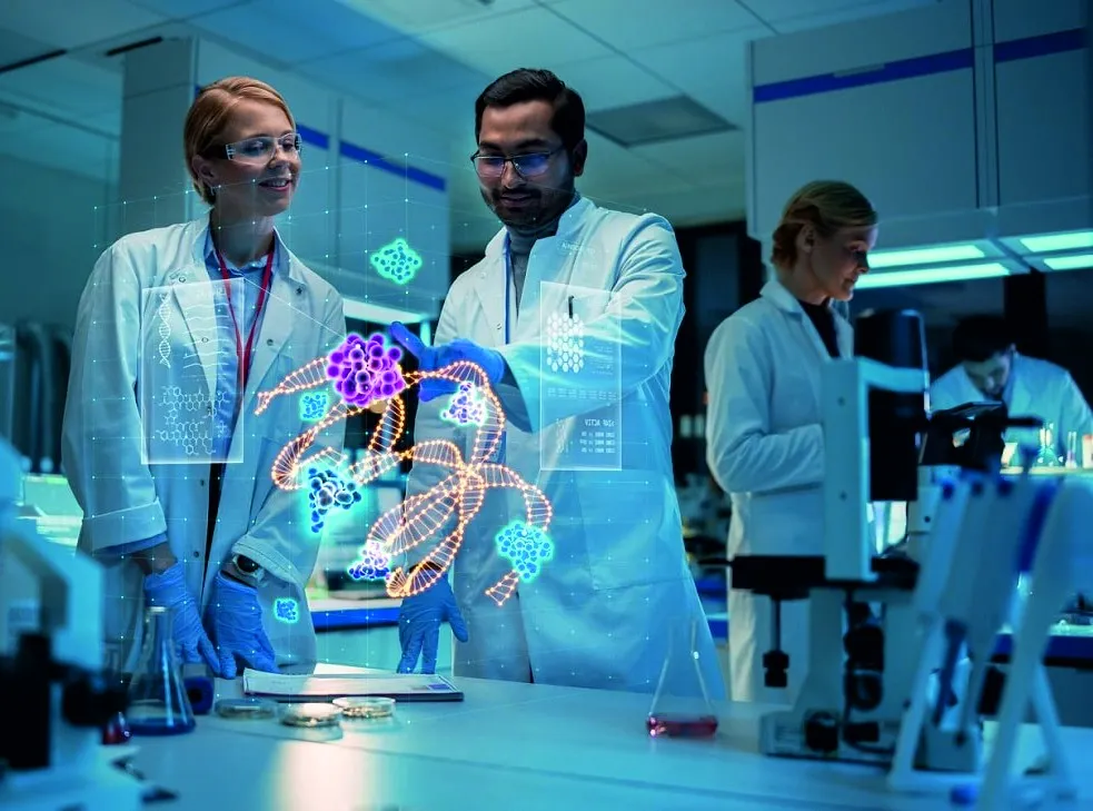 Scientists in white lab coats working together in a laboratory